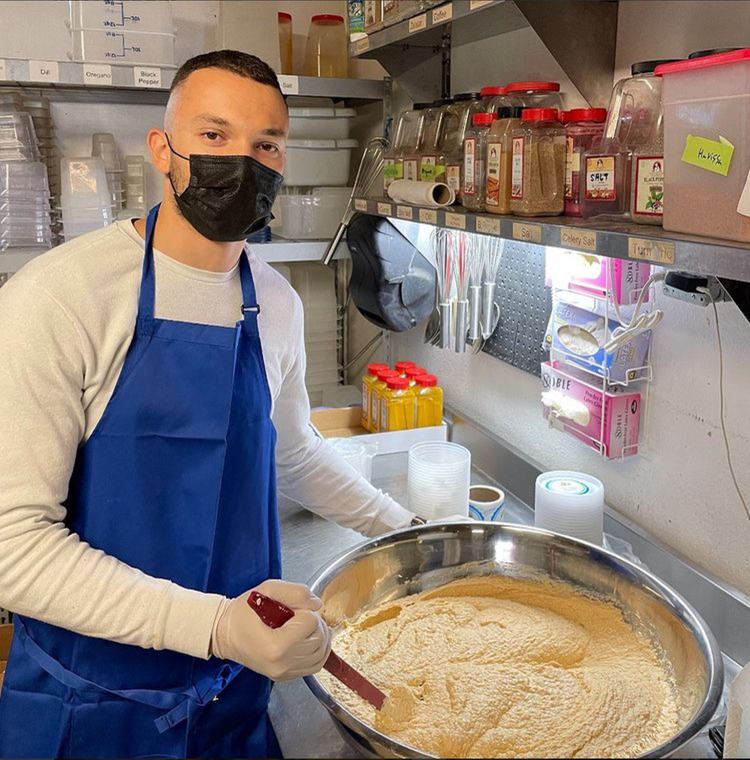Youssef Hamzaoui mixing a batch of hummus